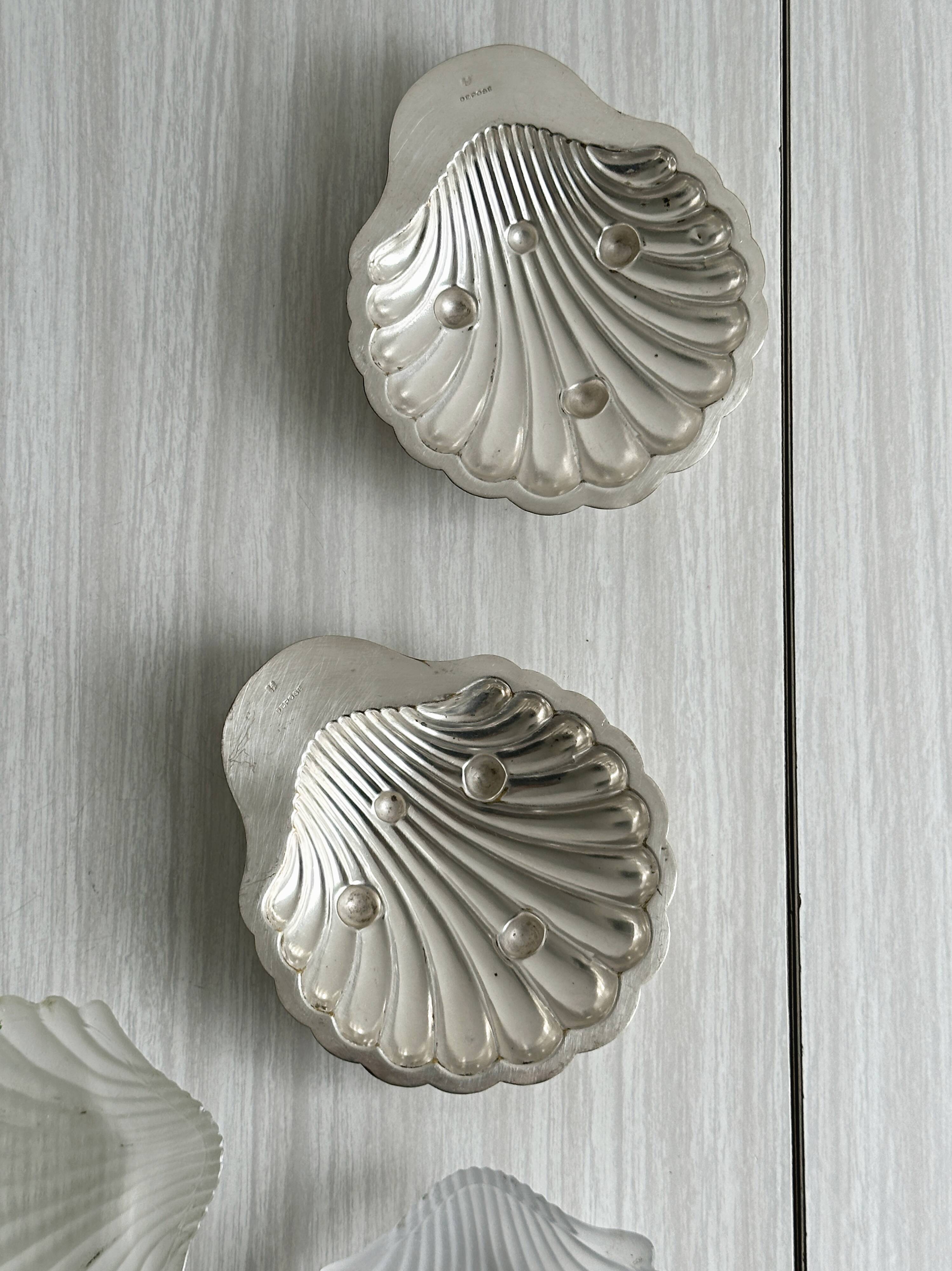 Pair of silver shell bowls