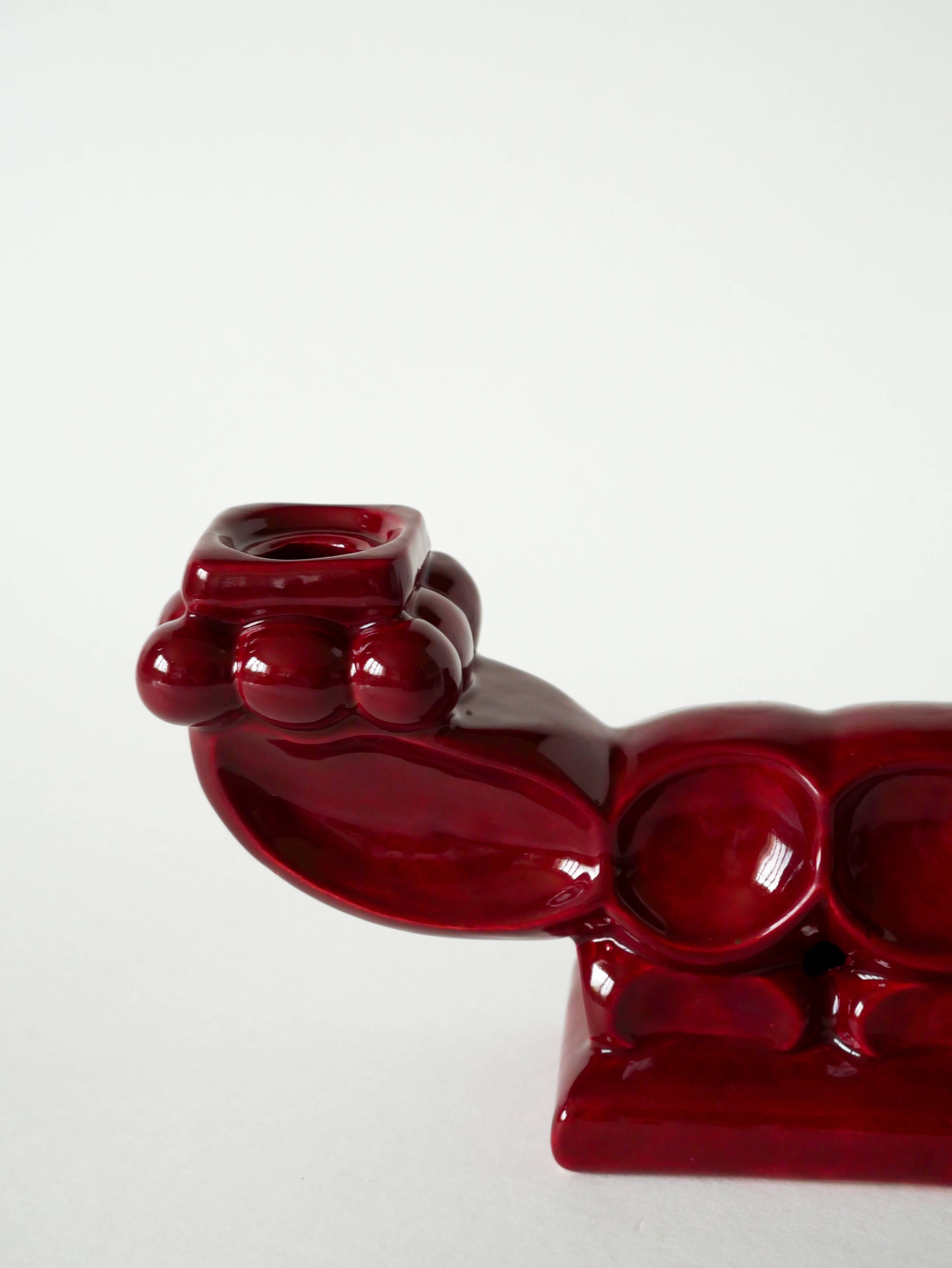 Pair of large burgundy ceramic candlesticks, 1950