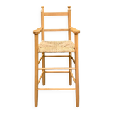 Old wooden and straw high chair for children