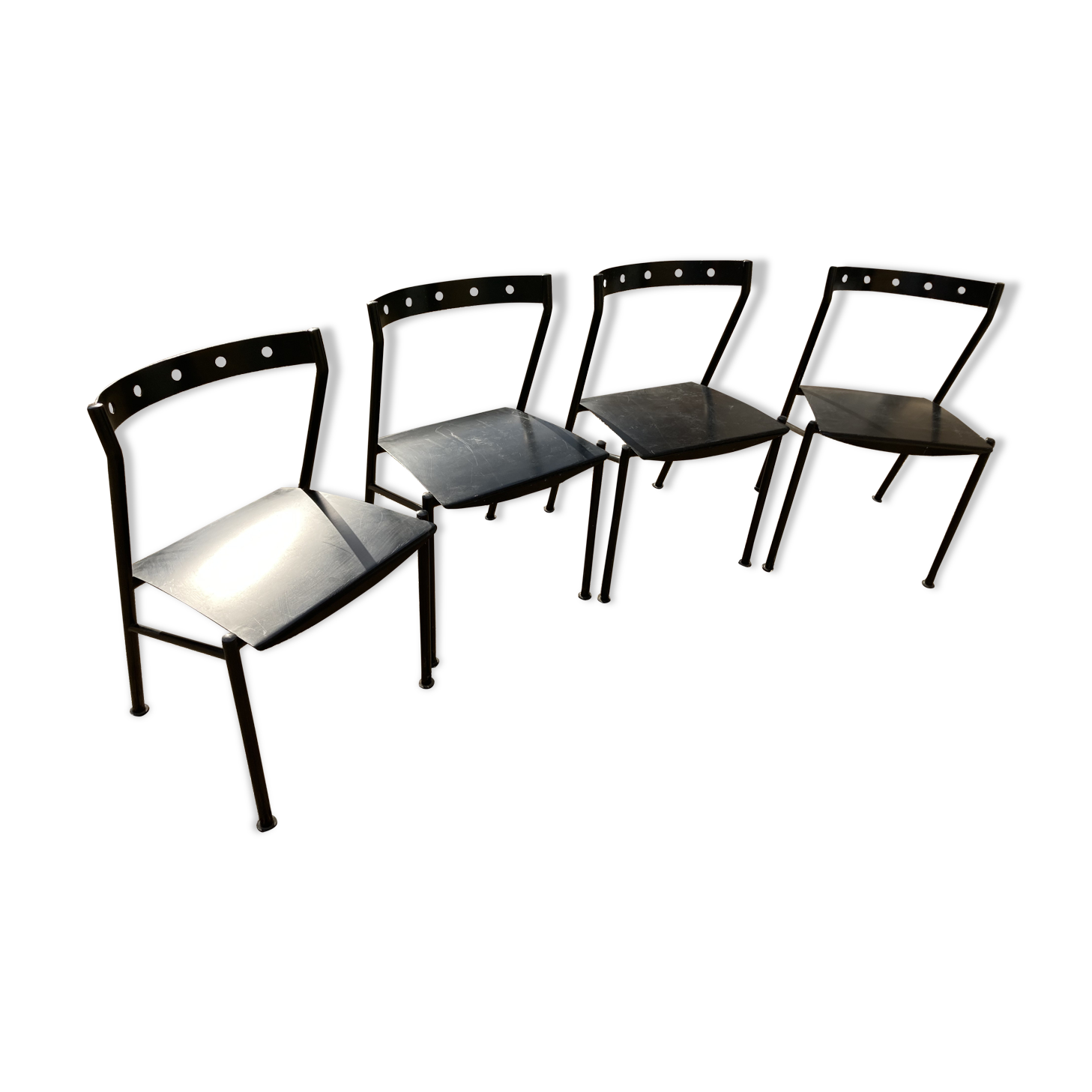 Series of 4 black iron chairs