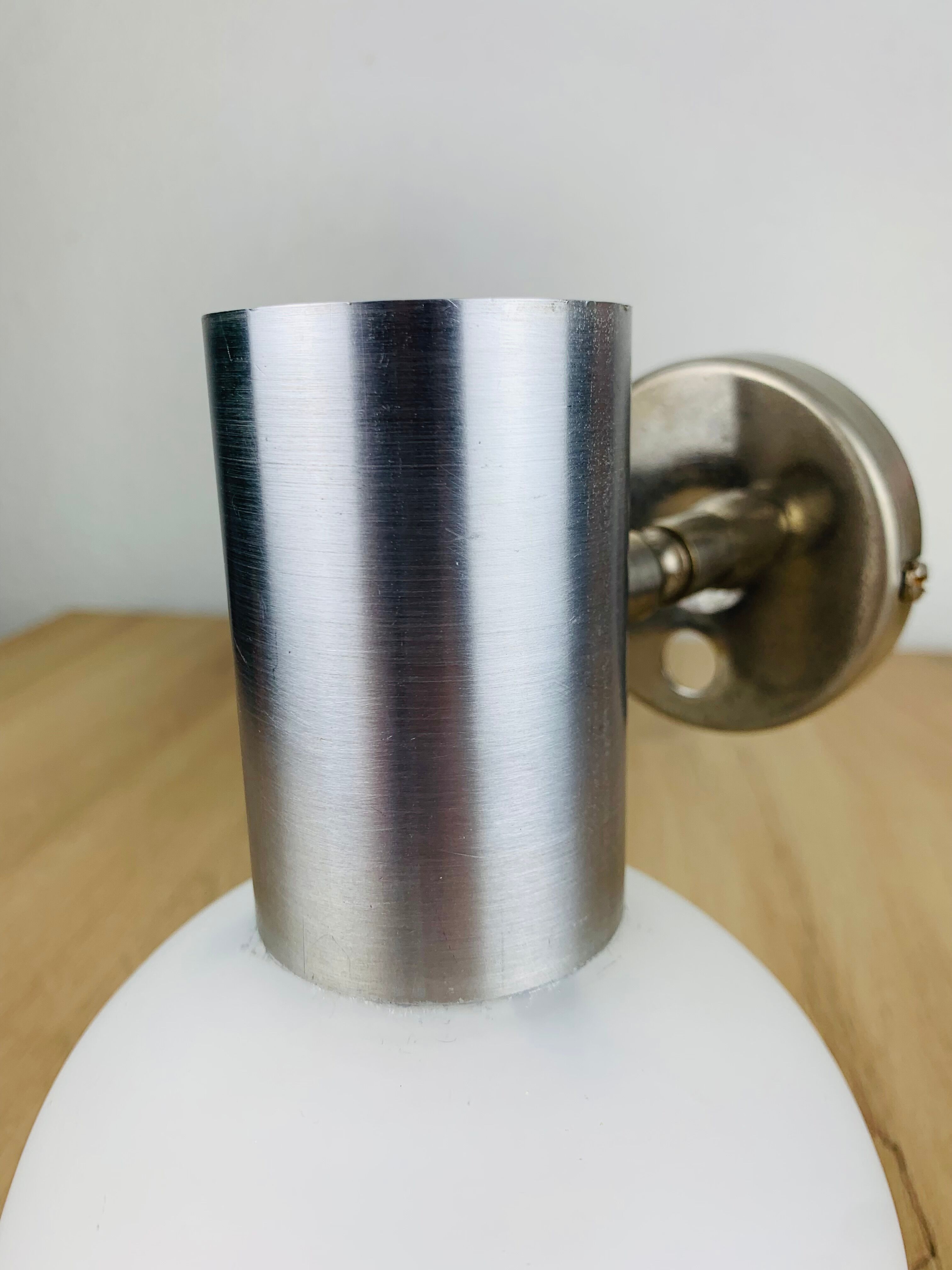 Space age opaline globe wall light, adjustable, and brushed metal, 1960s.