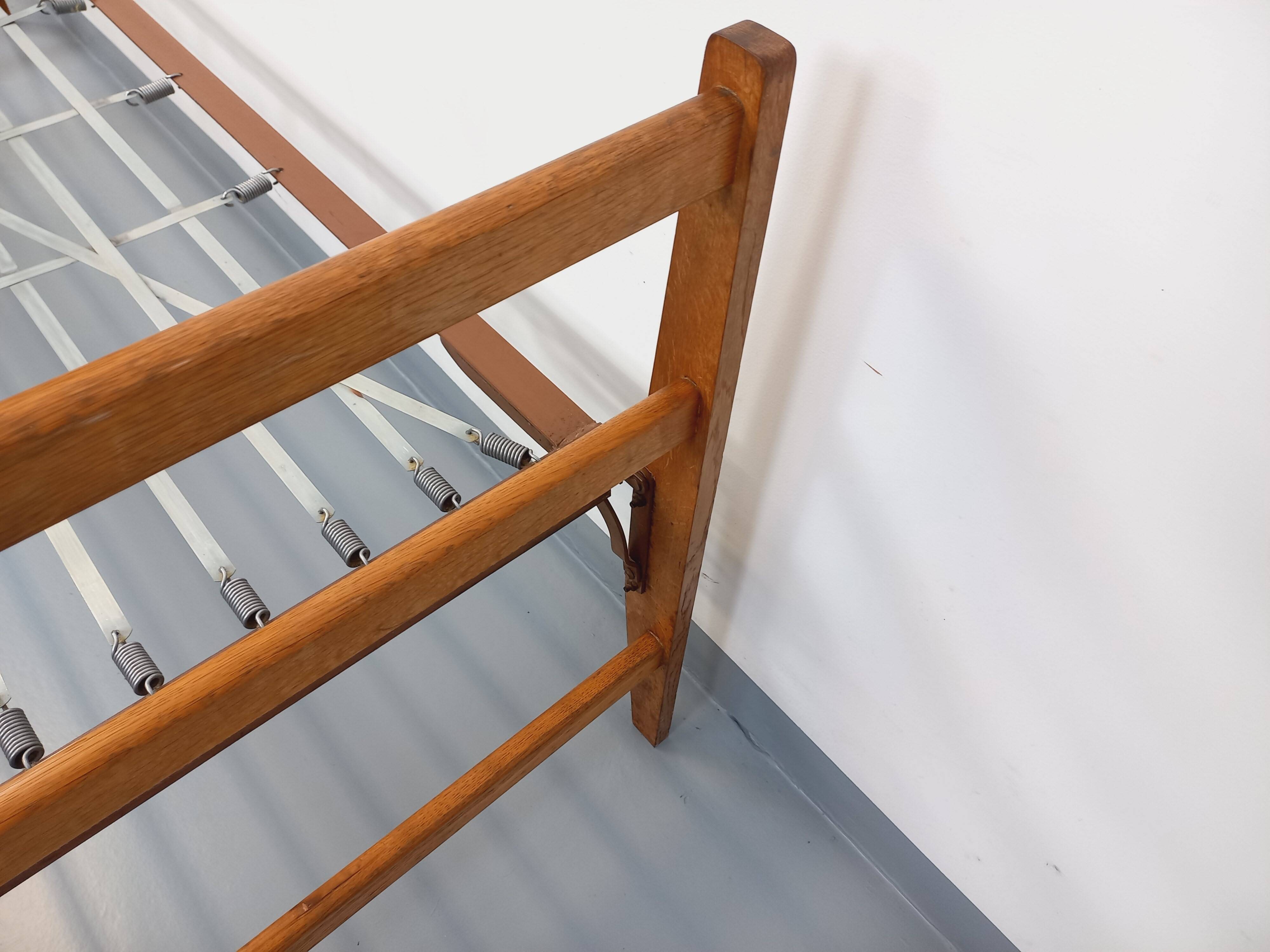 Pair of vintage stackable daybeds in oak wood and metal from the 60s