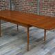 Teak dining table design by Johannes Andersen for Samcom 60s
