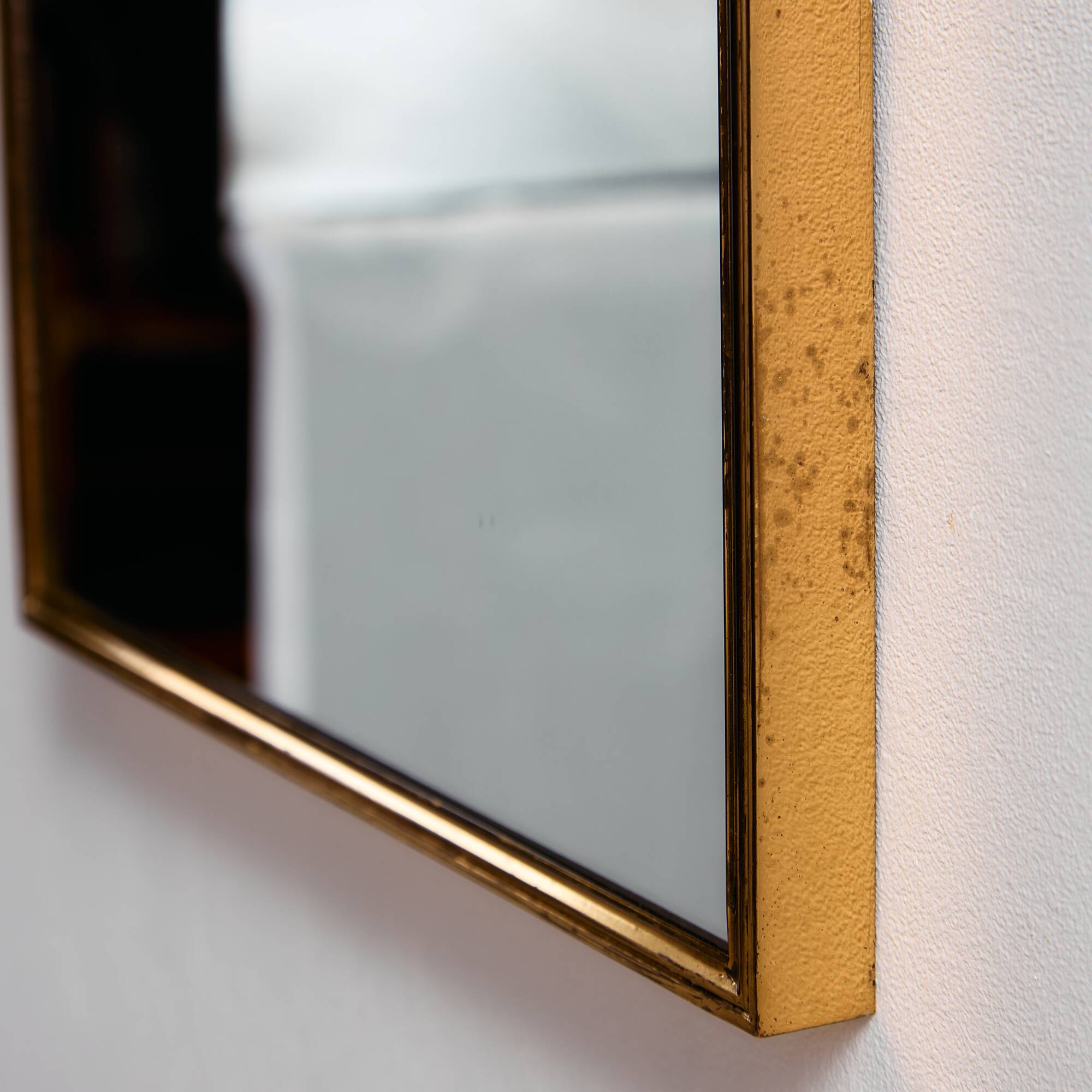 Metal and brass framed mirror