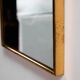 Metal and brass framed mirror