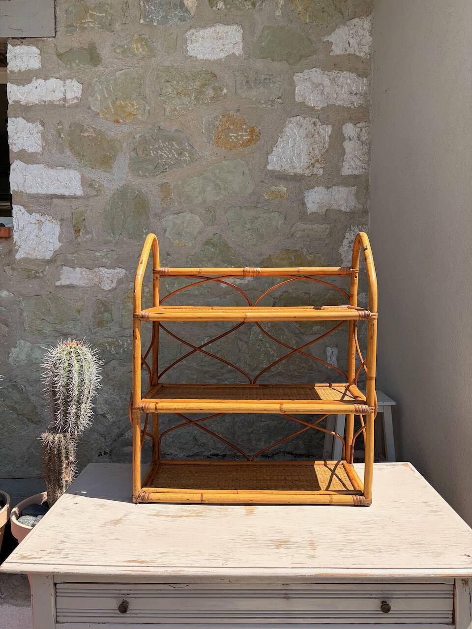 Vintage wall shelf in rattan