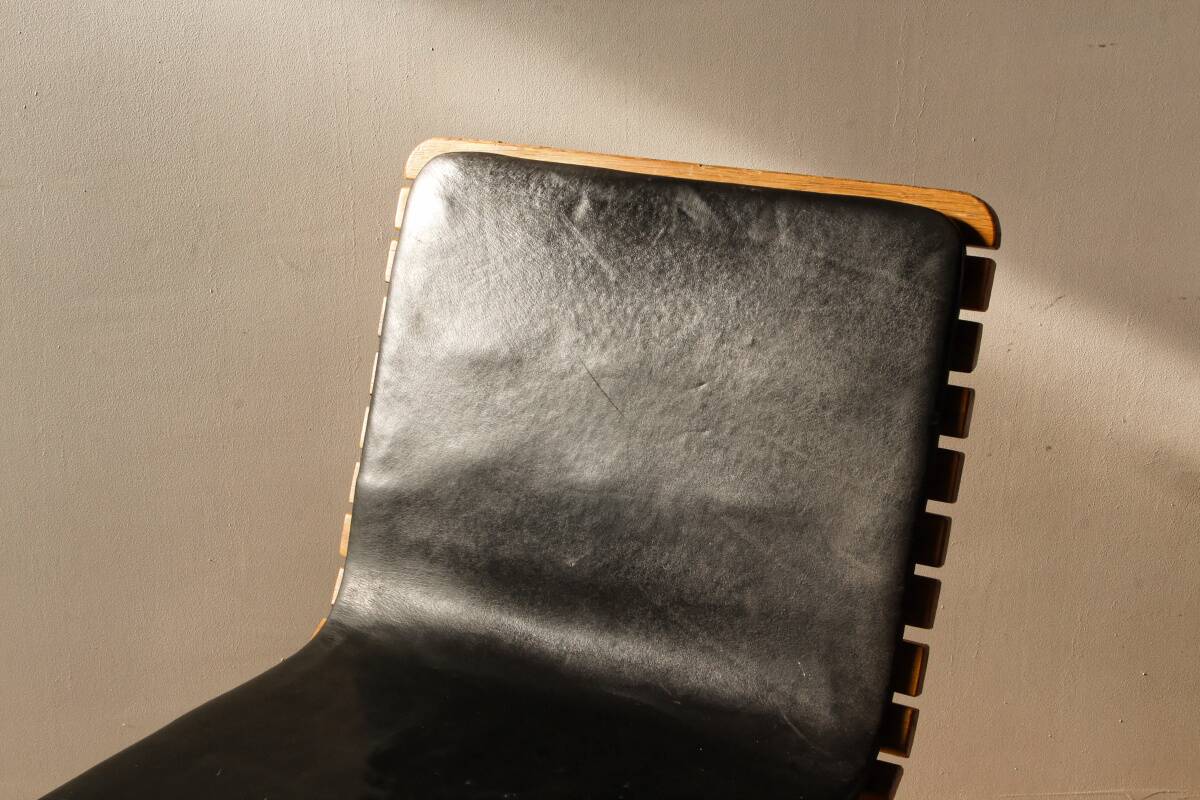 Handcrafted chair, laminated wood and leather
