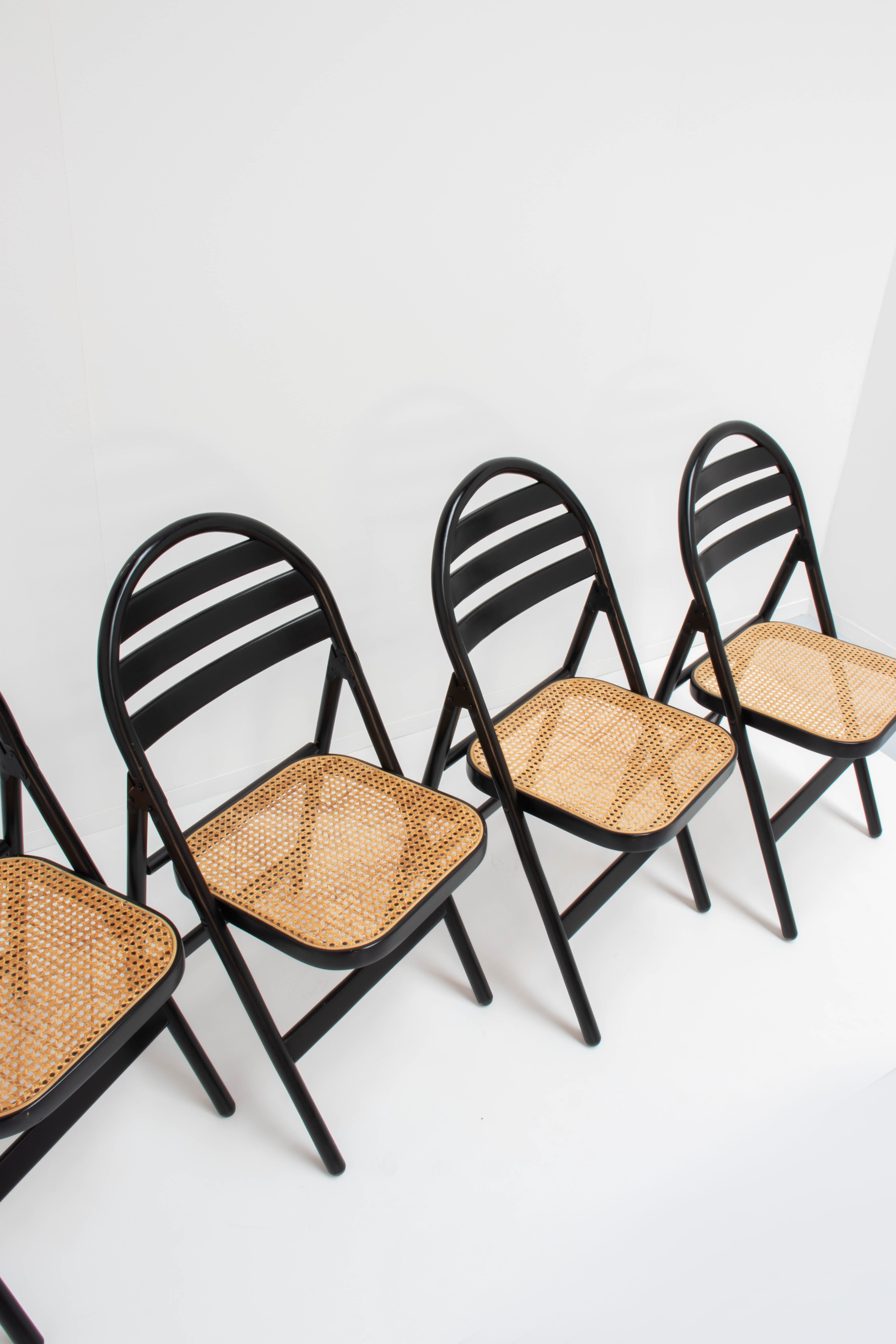 4 vintage wood folding chairs with cane seating