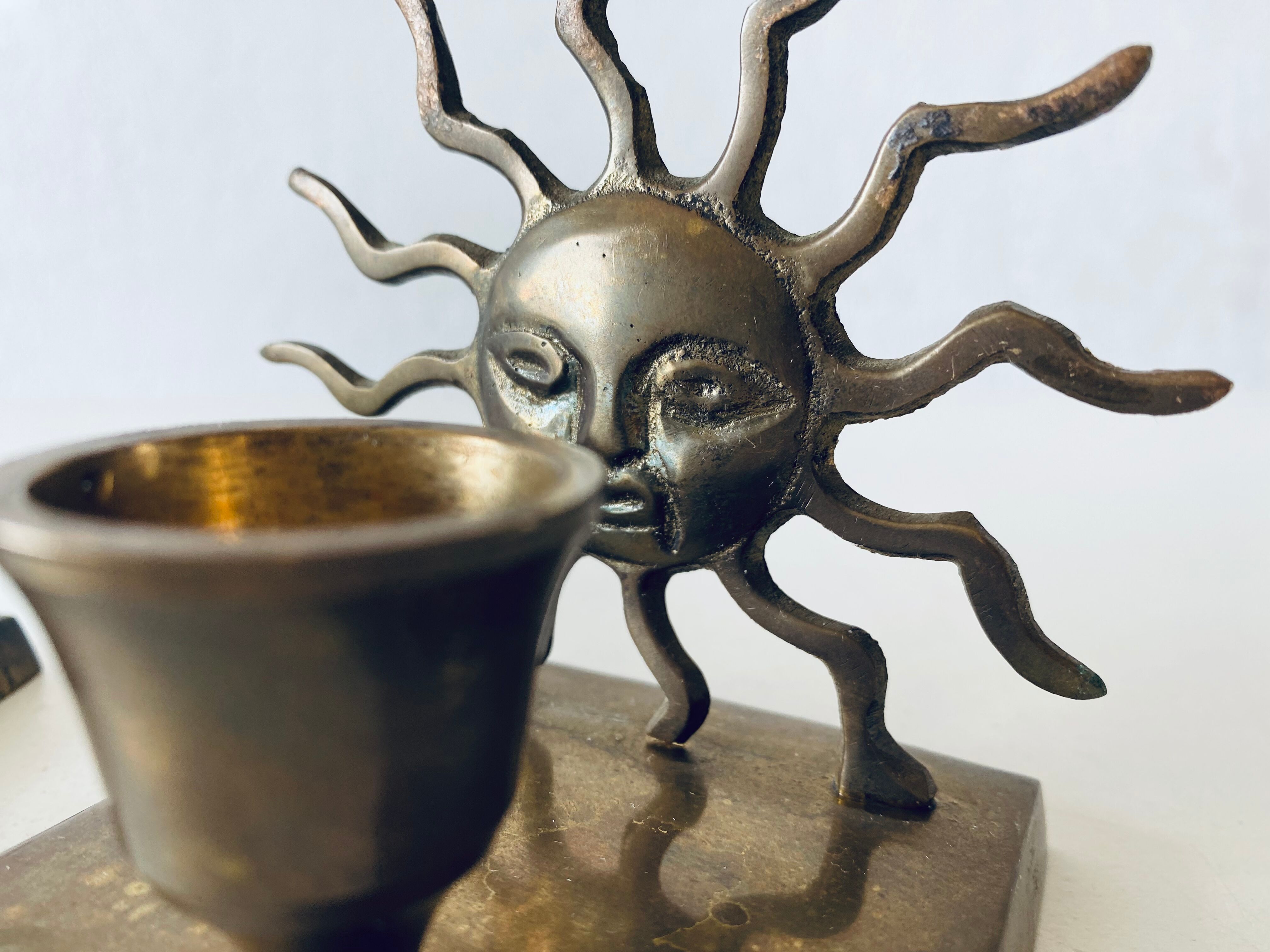 Pair of sun candle holders