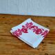 Set of 4 vintage white table napkins with pink flowers.