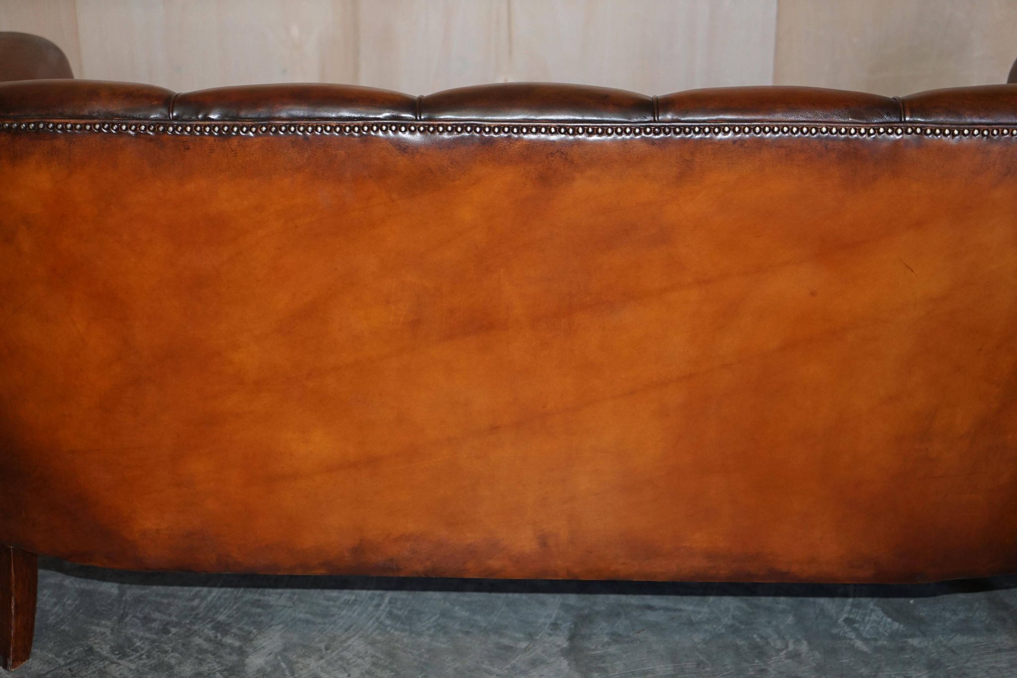 Victorian Chesterfield leather canapé with oak lion claw feet.