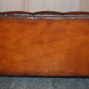 Victorian Chesterfield leather canapé with oak lion claw feet.