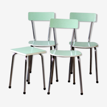 Trio of green formica chairs and their stool