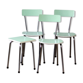 Trio of green formica chairs and their stool