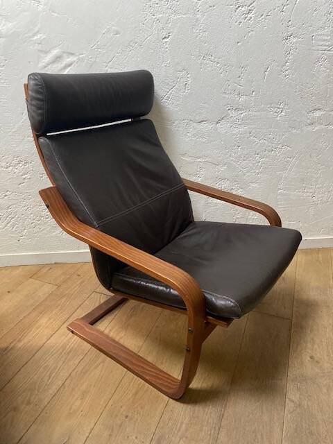 Leather armchair with footrest