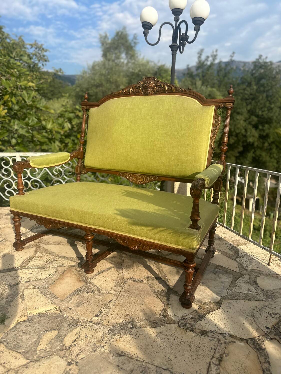 Richly carved solid wood bench in Louis XVI style.