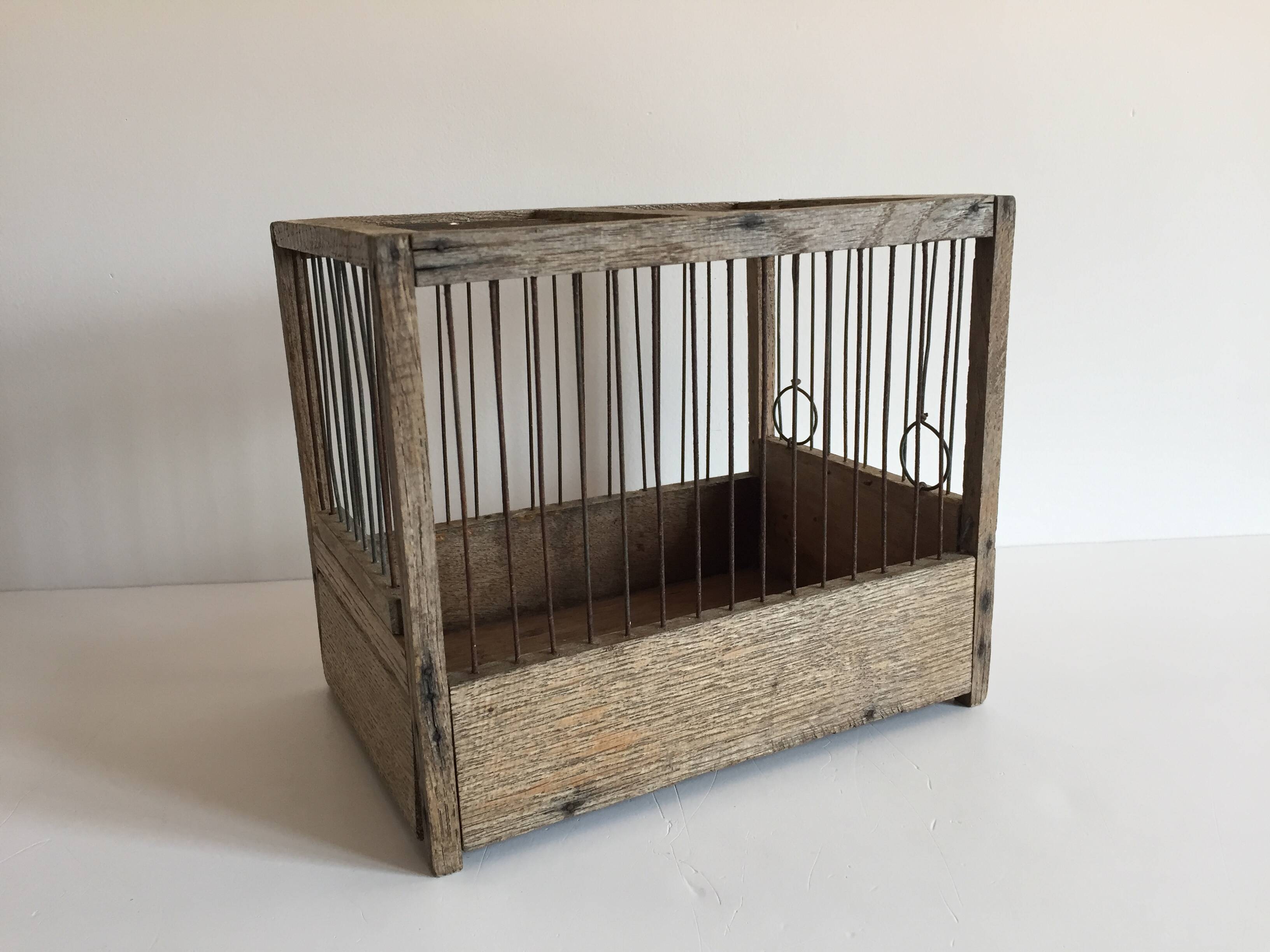 Old bird cage in wood and steel