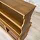Wooden hardware cabinet painted with wood effect, circa 1940.