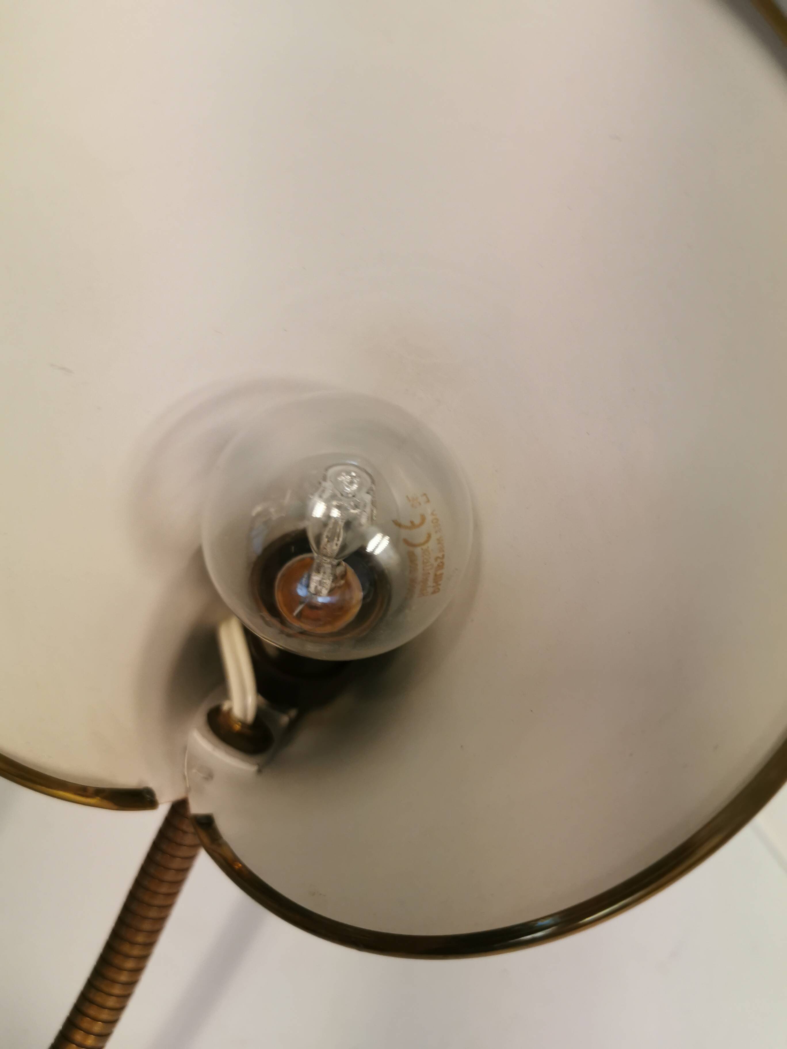 Danish red lacquered wall light with brass details. Estimated 1980s