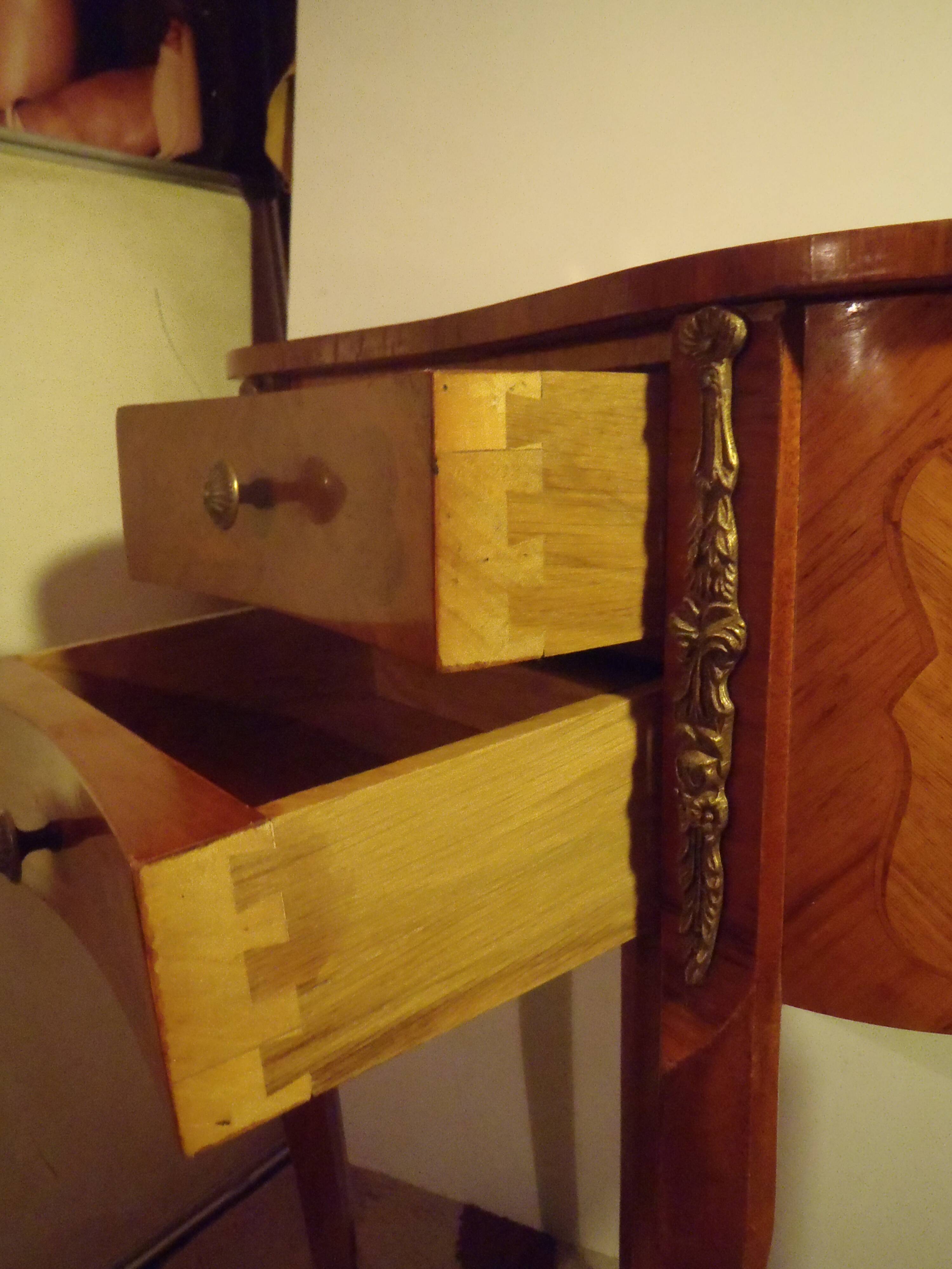 Louis XV style bedside table with varnished marquetry.
