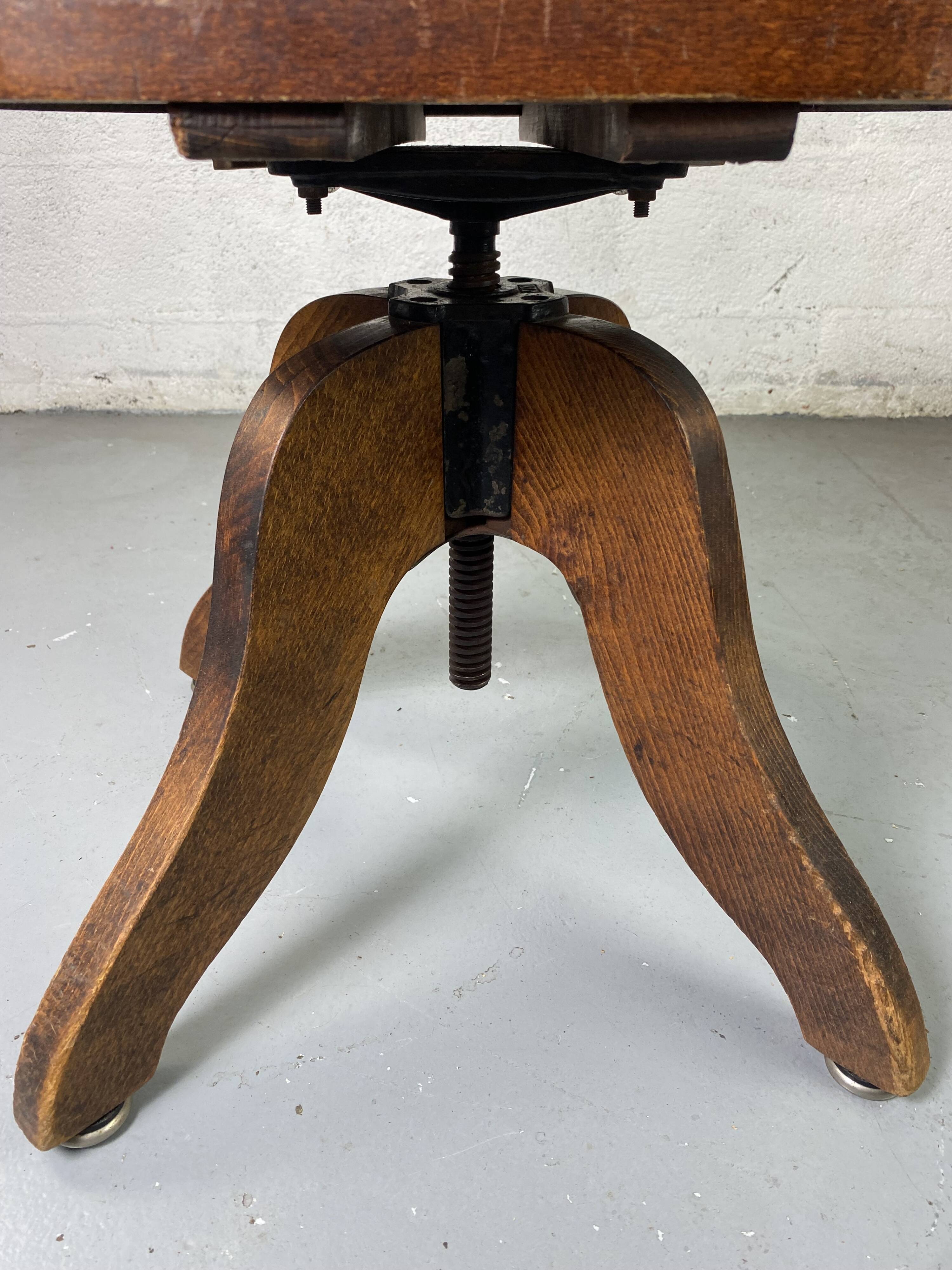 Baumann rotating wooden armchair