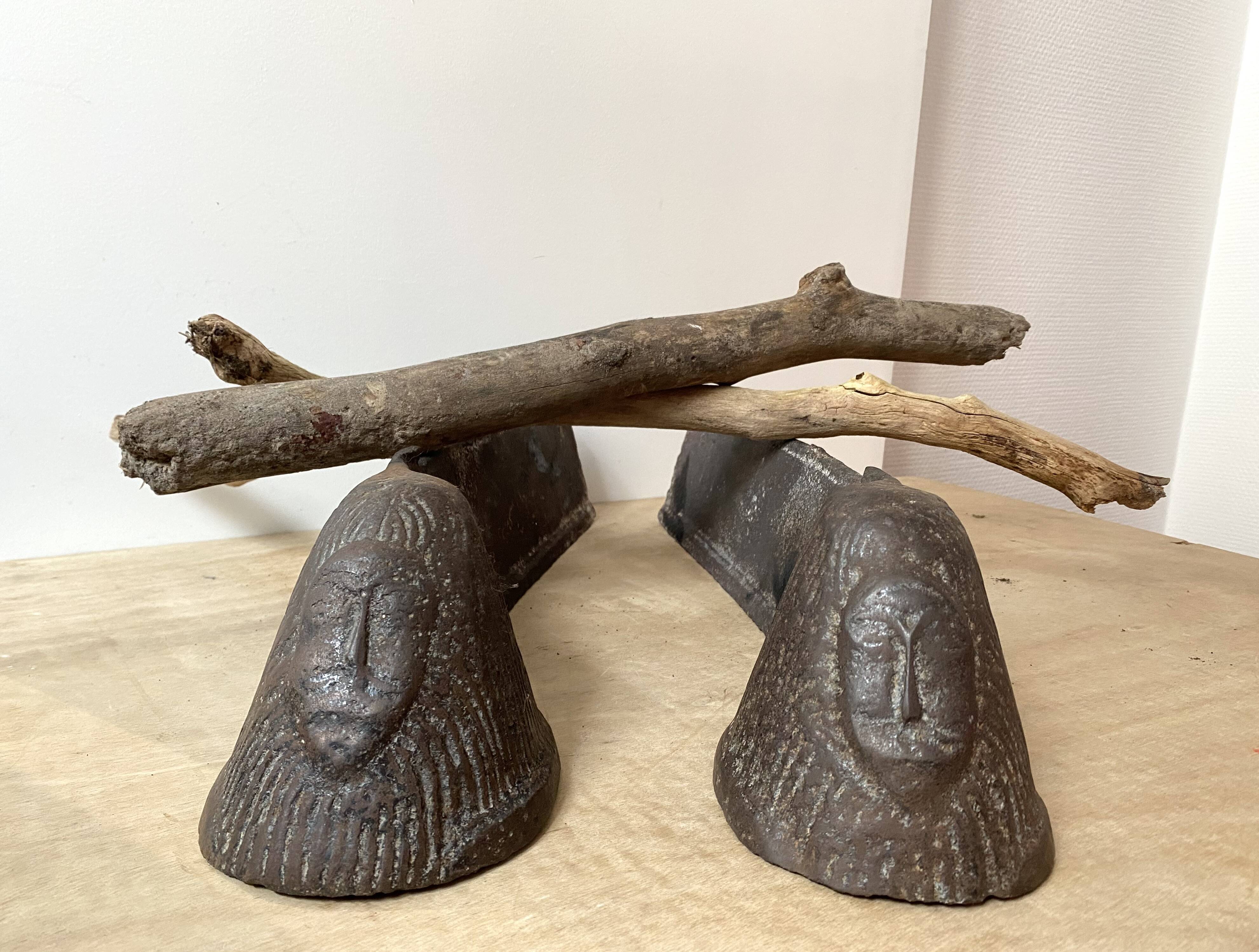 Pair of modernist anthropomorphic fireplace andirons, brutalist log holders 1950s
