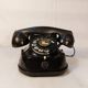 Ancien téléphone à cadran belge RTT 56B en bakélite noire