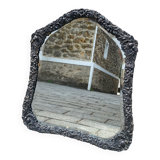 Old mirror carved in gray metal