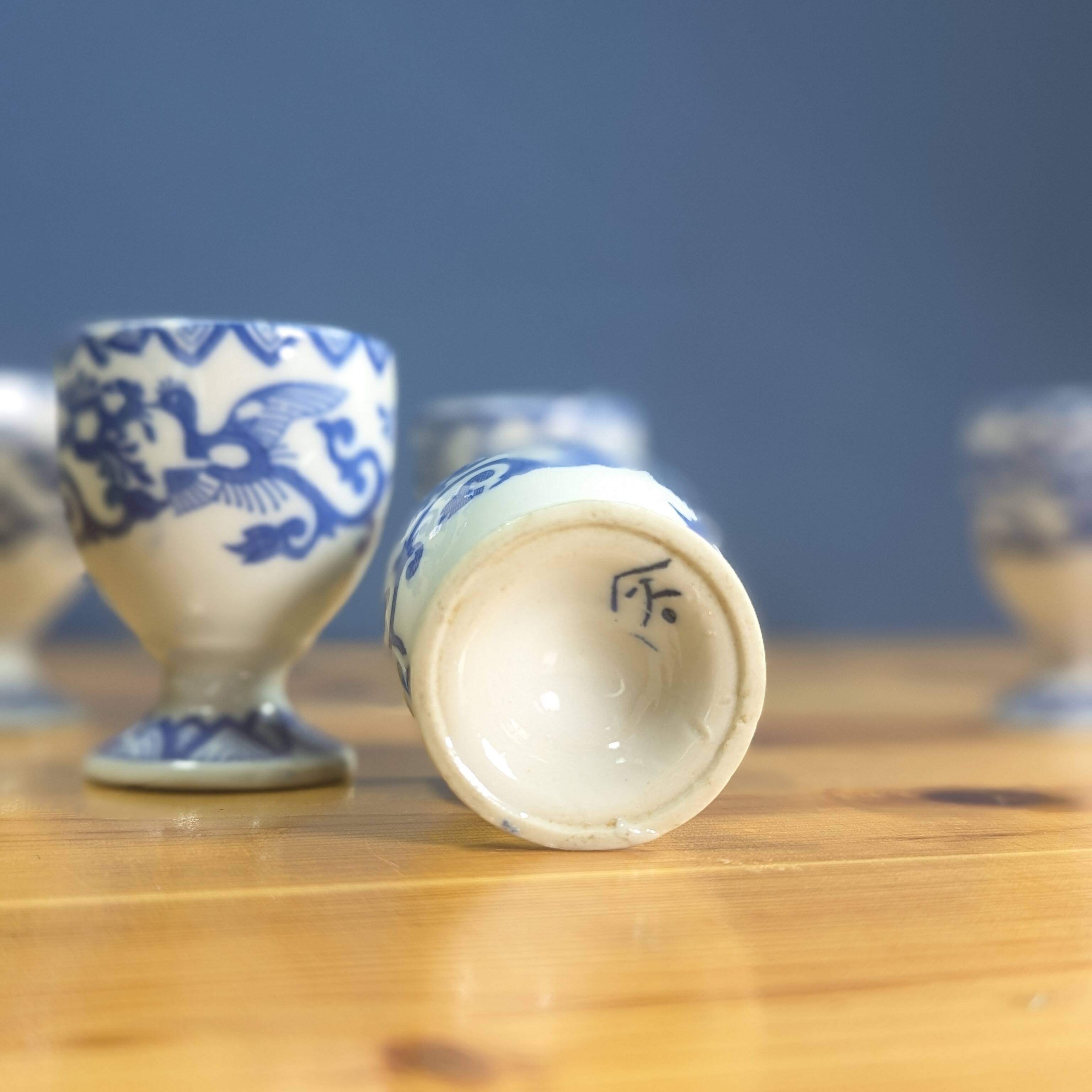 6 Japanese porcelain egg cups signed with blue bird flower geometry patterns