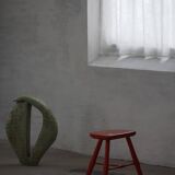 Pair of patinated wooden stools painted red with flared legs, 1950s-1960s.