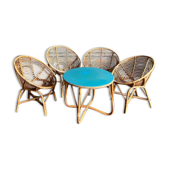 Rattan living room consisting of a coffee table and 4 rattan shell armchairs