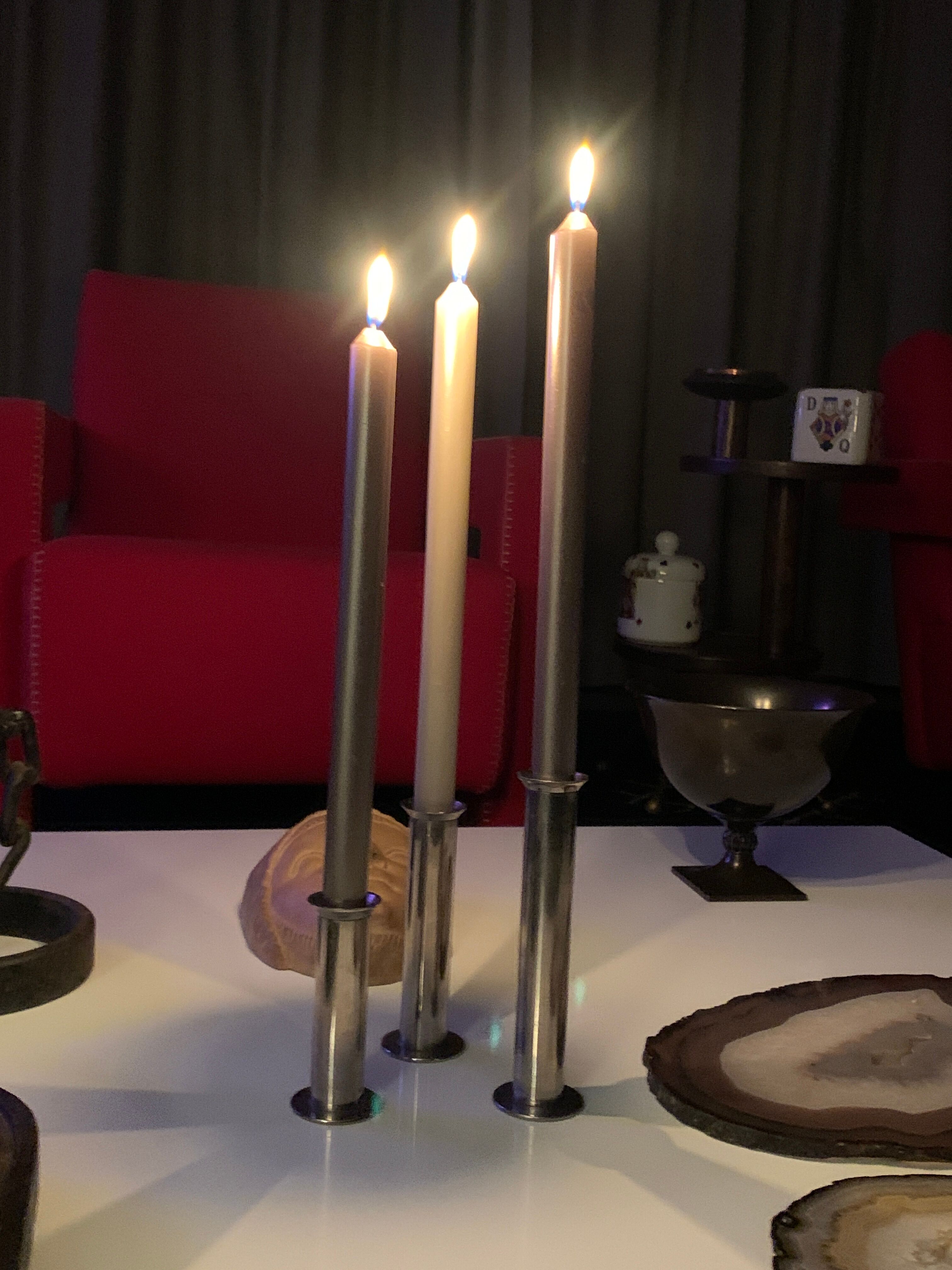 Three silver metal candle holders