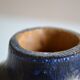 Ceramic bottle vase with a fish signature to be identified.