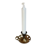 Antique brass rat trap with heart patterns.