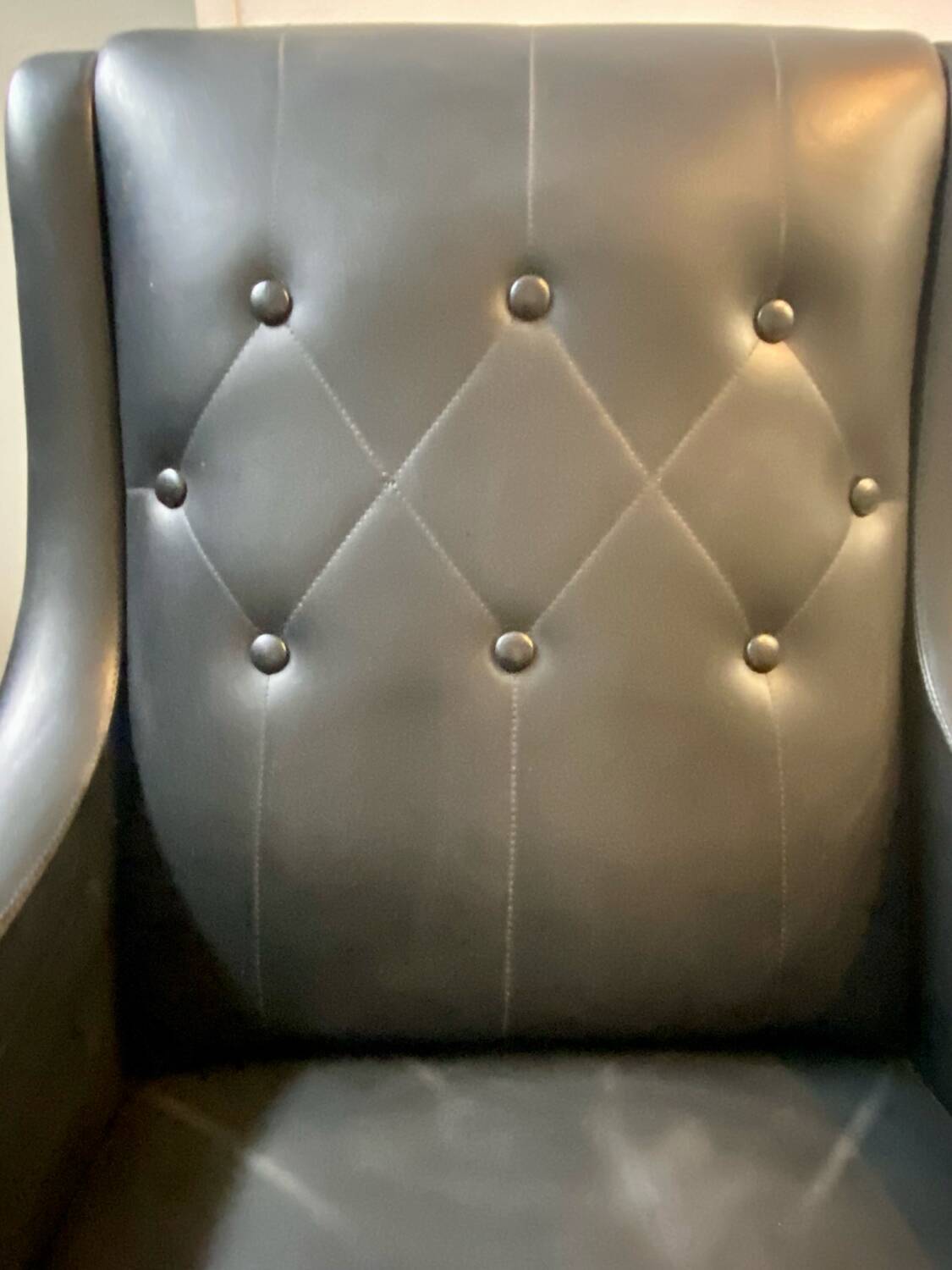 2 vintage faux leather armchairs