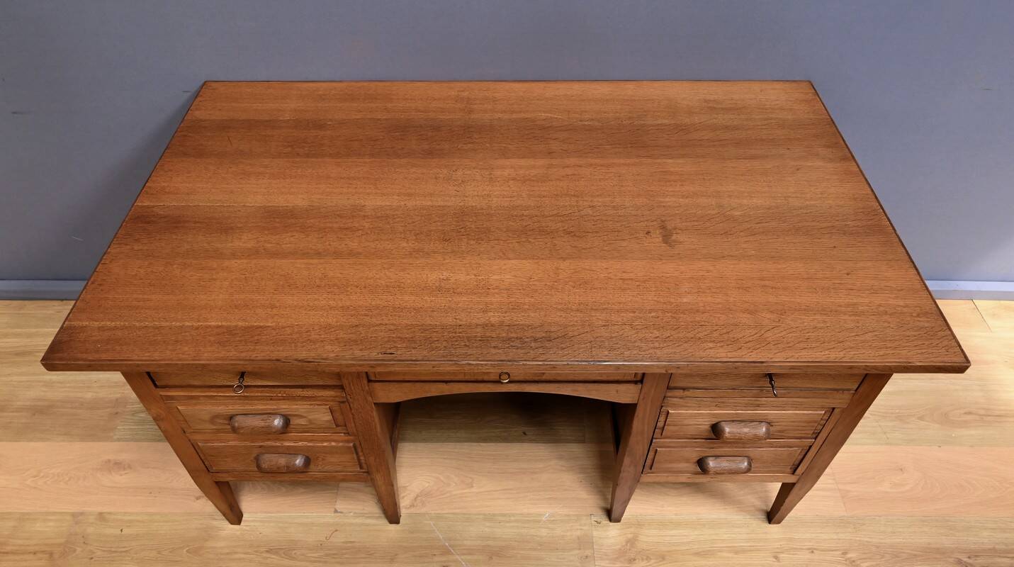 Solid oak pedestal desk, Régy establishments – 1940