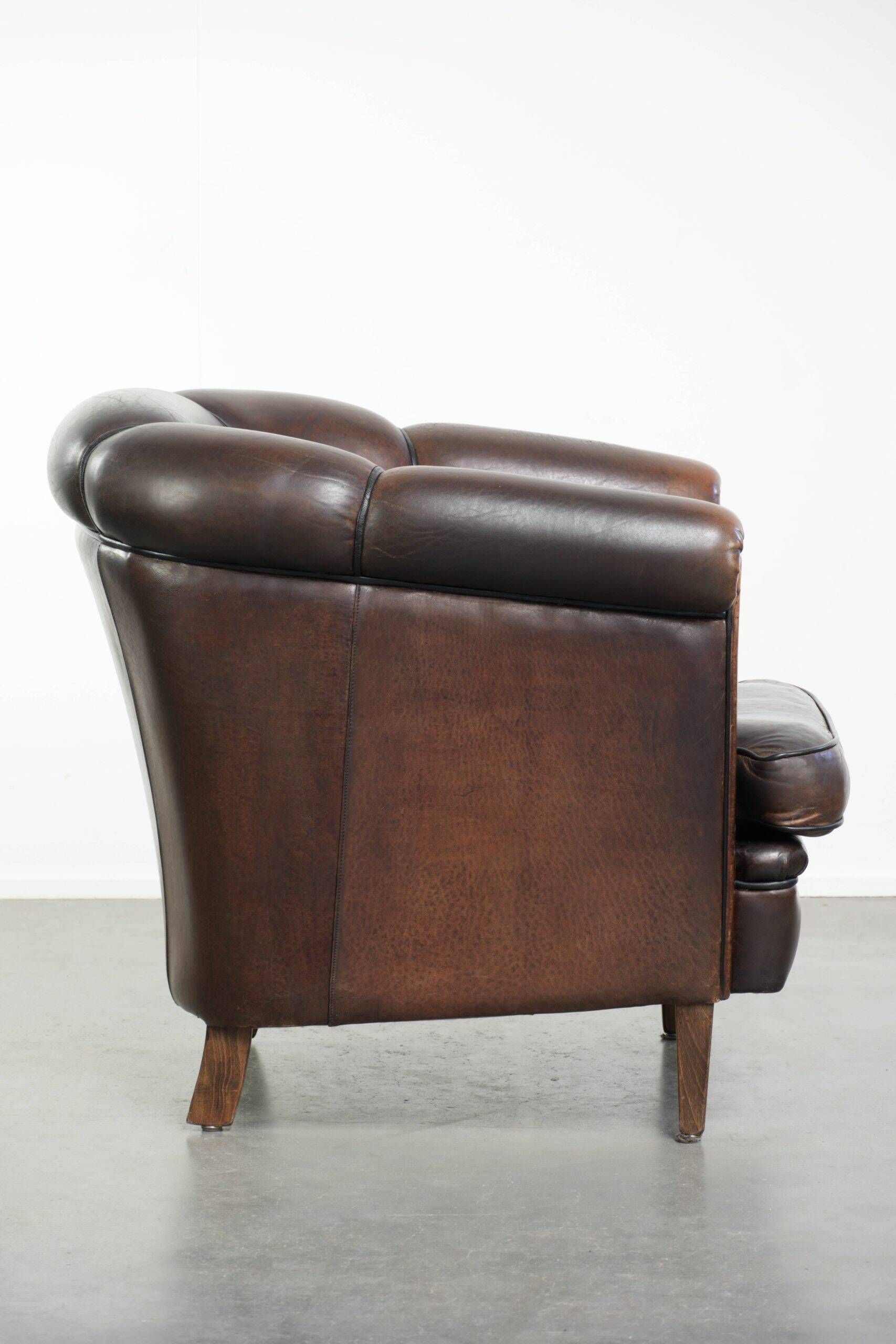 Dark sheepskin club armchair with unique design in English style