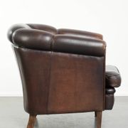 Dark sheepskin club armchair with unique design in English style