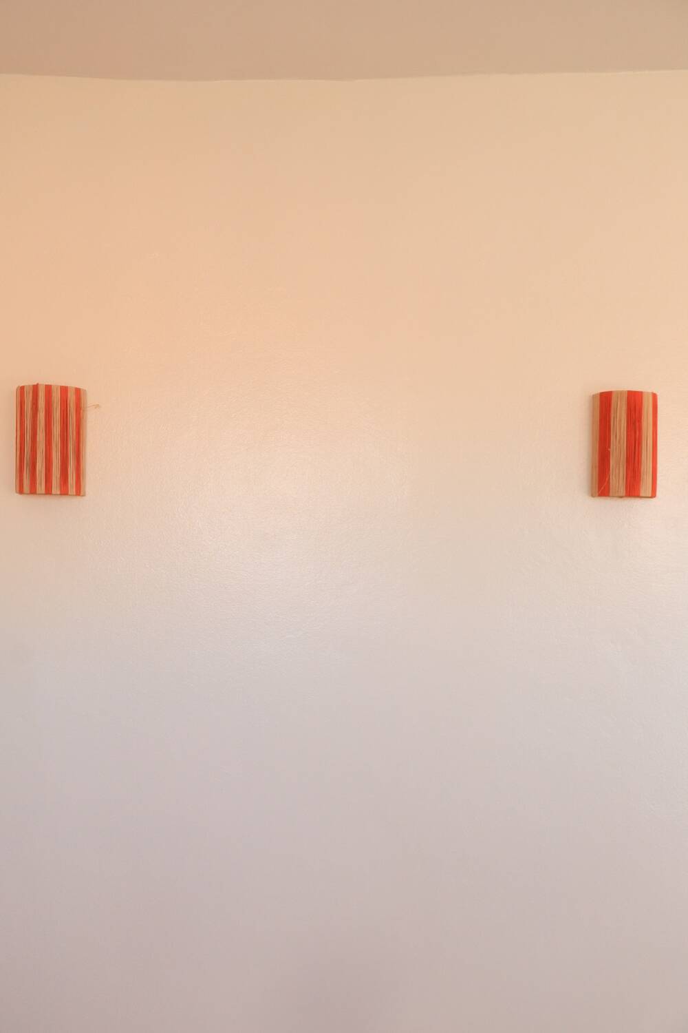 Orange and natural striped raffia wall light