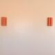 Orange and natural striped raffia wall light