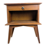 Vintage bedside table with tapered legs.