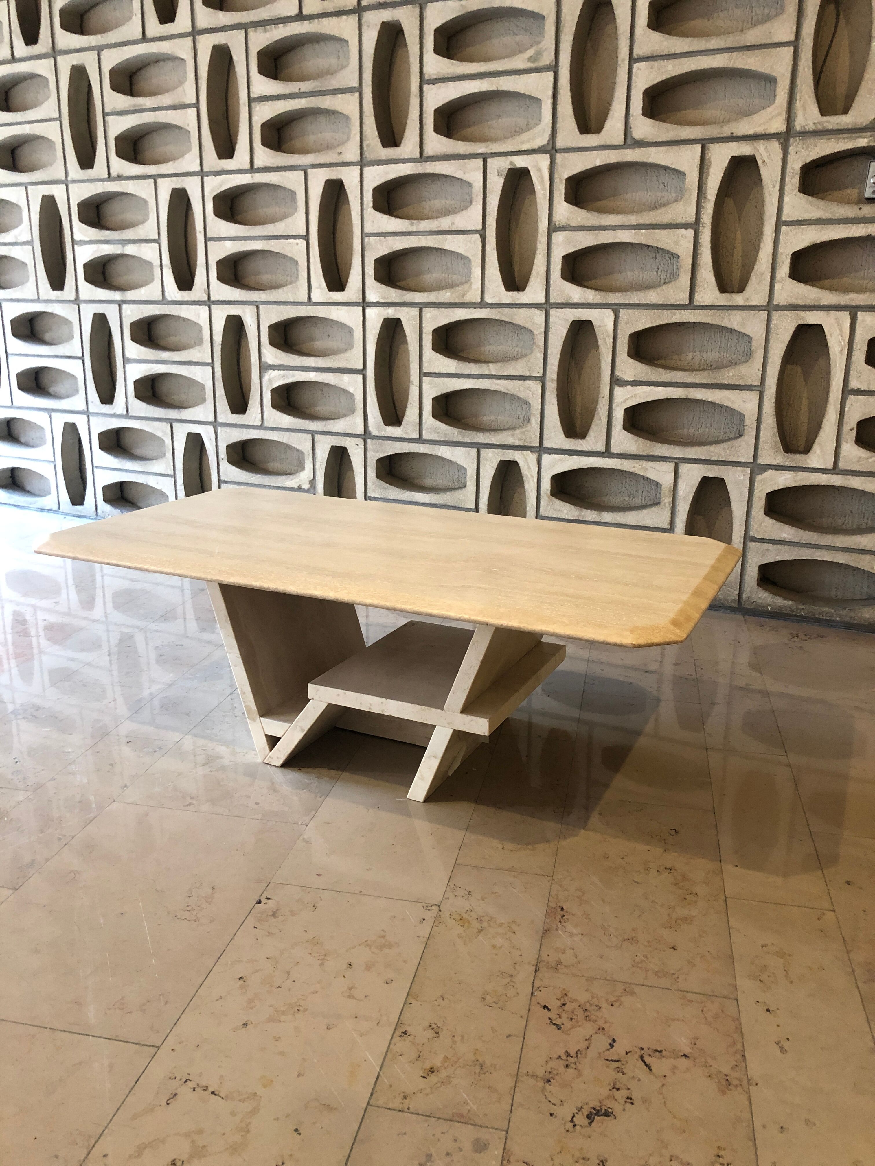 Rectangle travertine table with geometric foot