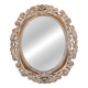 Distressed and carved golden oval mirror in wood.