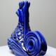 Pair of ceramic glazed candlesticks in the shape of roosters, signed A.G Roger, year 1948.