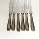 6 silver metal knives