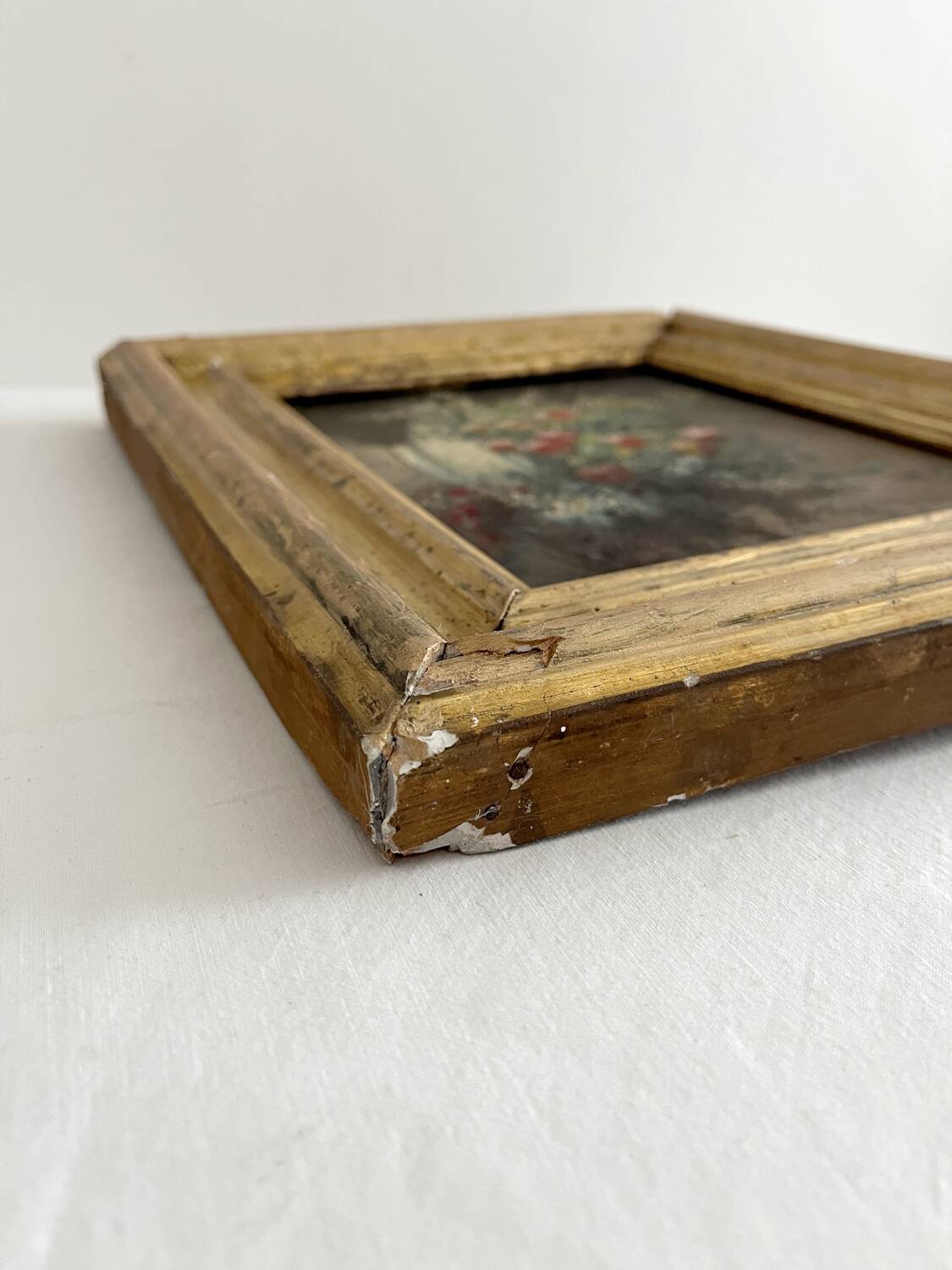 Old oil painting on wood of a bouquet of flowers signed Petit.