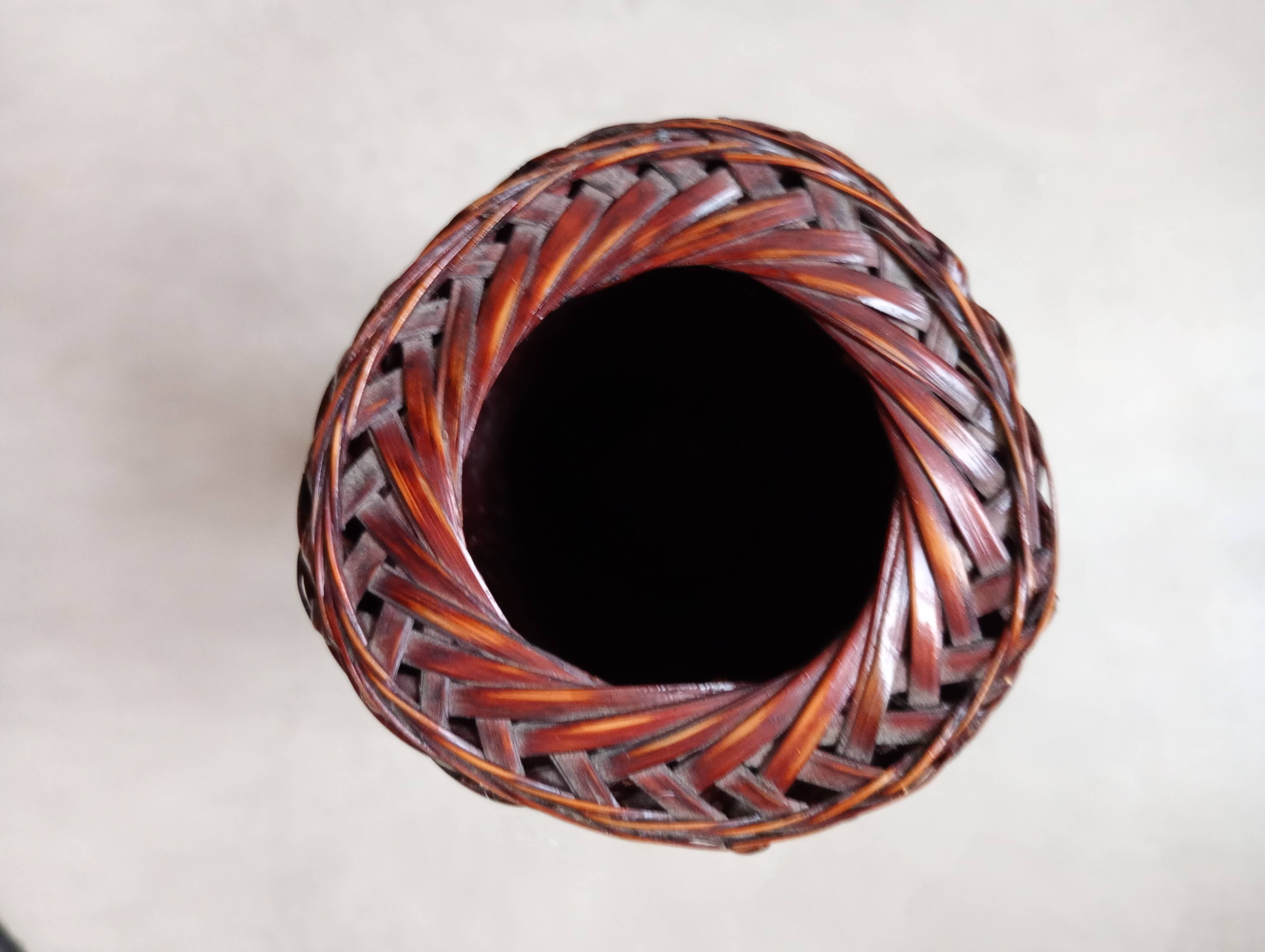 Japanese vase made of woven bamboo. Ikebana