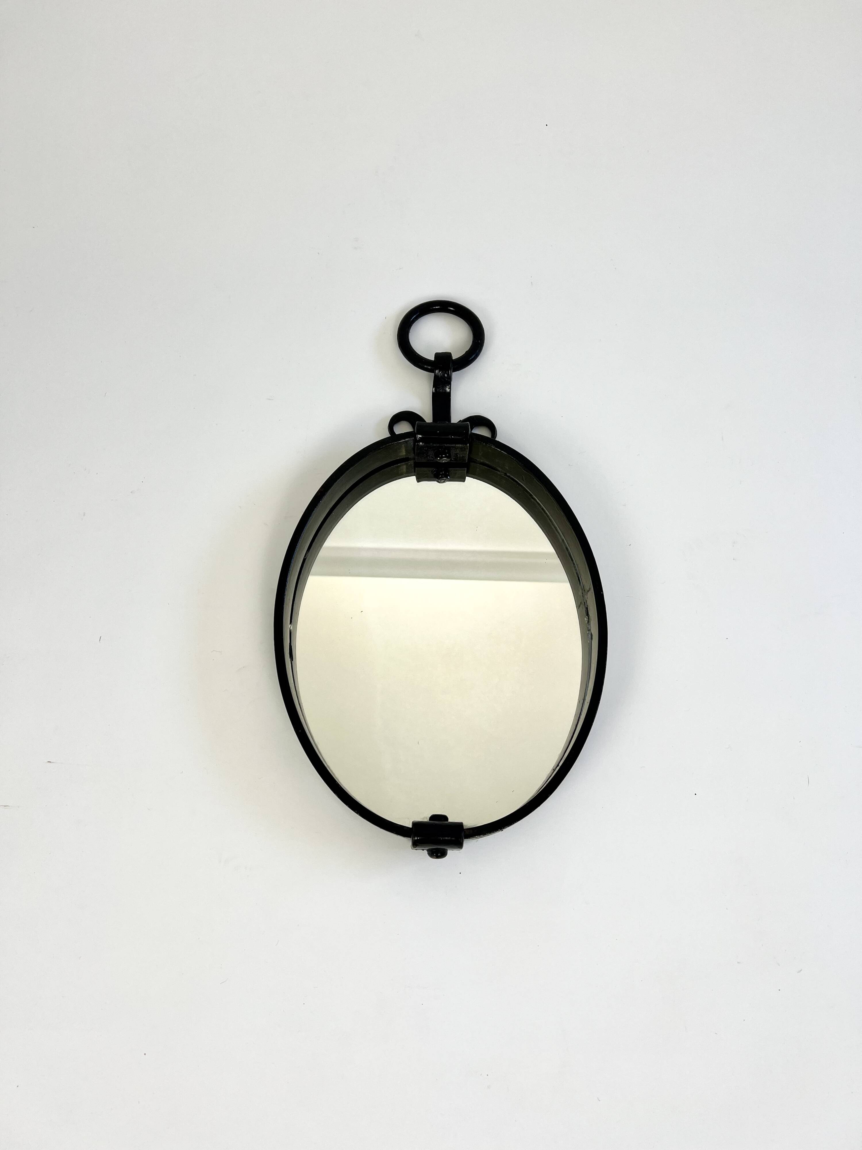 Miroir mural ovale brutaliste du milieu du siècle