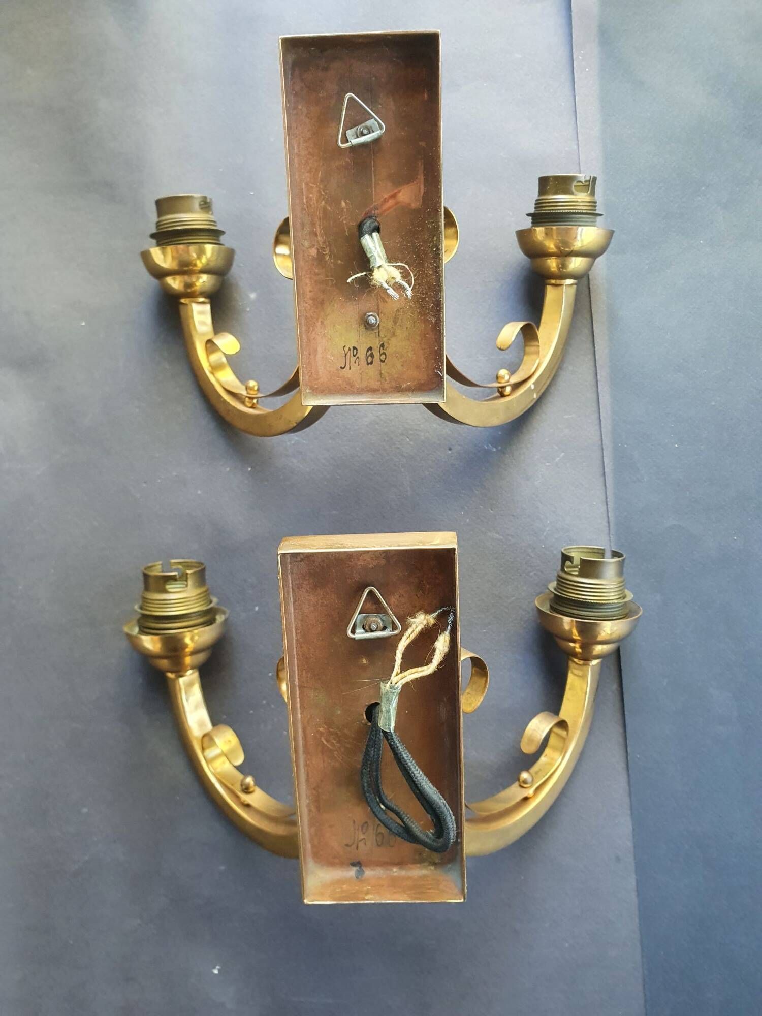 Pair of bronze wall sconces with 1940s Art Deco lampshades.