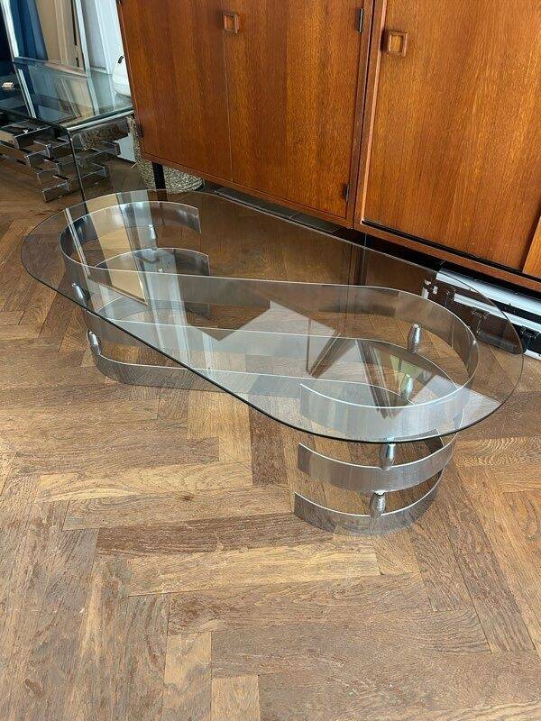 70s oval design coffee table in glass with chrome S legs.